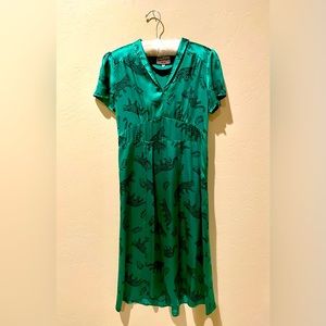 HVN , green silk/satin dress with short sleeves and a V-Neck. Size 8
